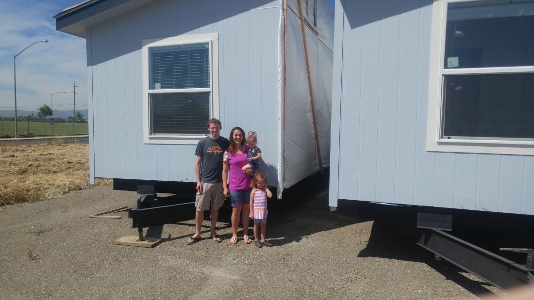 Family in front of divided home