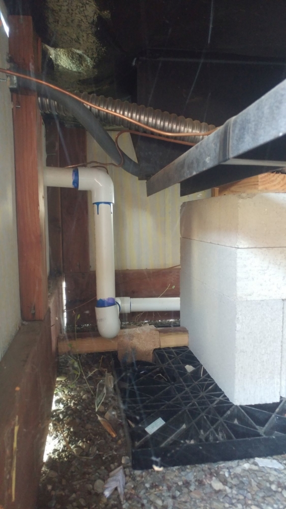 PVC pipe under a home