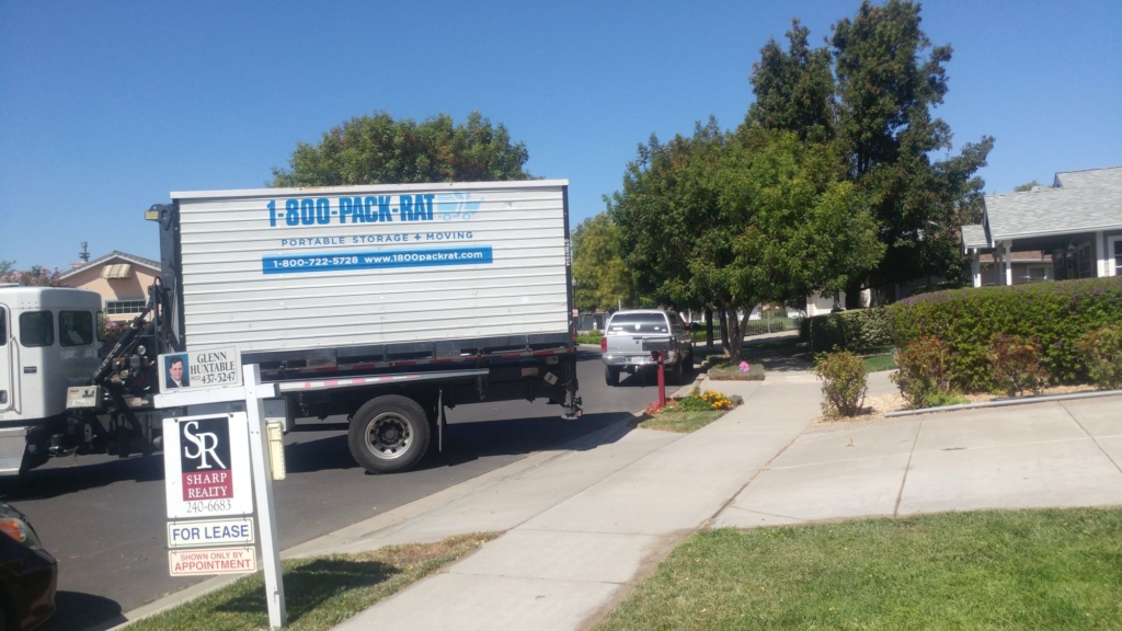 storage truck moving down a street